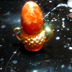 Orange Crystal egg (stand not included)I don't think its real